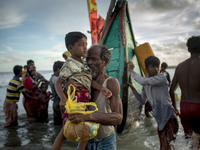 Rohingya refugees are seen after arriving on a boat to Bangladesh on Shah Porir Dip Island Teknaf, Bangladesh 14 September 2017. According t...