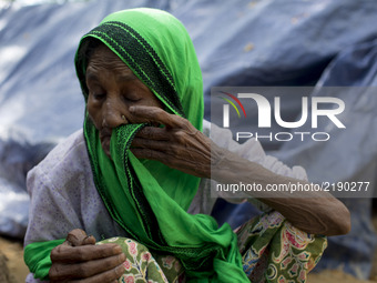 A Rohingya old woman stands close to her makeshift tent at the Balukhali camp in Ukhiya, Bangladesh 15 September 2017. Many of the Rohingya...