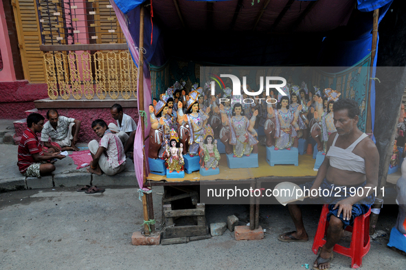 An Indian artist waiting for costumer at the artisan's village of Kumartoli in Kolkata on September 16, 2017. Durga Puja, the annual Hindu f...