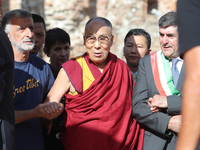 Mayor of Messina Renato Accorinti (L) and ayor of Taormina Eligio Giardina (R) with The Dalai Lama, Tenzin GYATSO (C) at the Greek Theatre i...