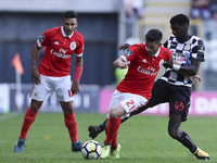 Benfica's Portuguese midfielder Pizzi (L) with Boasvista`s player Gilson (R) during the Premier League 2017/18 match between Boavista FC and...