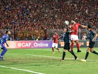 Ahly player Emad Miteb jumping during the CAF Champions League quarterfinal first-leg football match between Egypt's Al-Ahly and Tunisia's E...