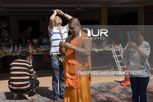 Thai Buddhist devotees send off souls of ancestors during the Ancestors Festival at the Thai Buddhist Chetawan Temple in Petaling Jaya, Mala...