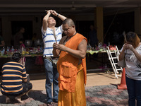 Thai Buddhist devotees send off souls of ancestors during the Ancestors Festival at the Thai Buddhist Chetawan Temple in Petaling Jaya, Mala...