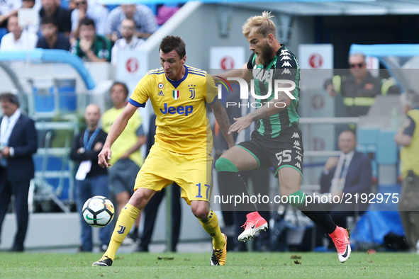 
Mario Mandzukic of Juventus and Timo Letschert of Sassuolo  during the Serie A match between US Sassuolo and Juventus at Mapei Stadium - Ci...