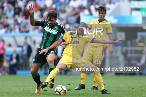 
Francesco Magnanelli of Sassuolo and Gonzalo Higuain of Juventus  during the Serie A match between US Sassuolo and Juventus at Mapei Stadiu...