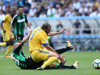 
Paolo Cannavaro of Sassuolo tackling on Gonzalo Higuain of Juventus  during the Serie A match between US Sassuolo and Juventus at Mapei Sta...