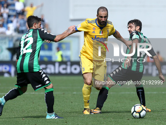 
Gonzalo Higuain of Juventus between Stefano Sensi of Sassuolo and Francesco Magnanelli of Sassuolo  during the Serie A match between US Sas...