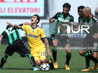 
A fool by Stefano Sensi of Sassuolo on Paulo Dybala of Juventus  during the Serie A match between US Sassuolo and Juventus at Mapei Stadium...