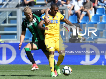 
Timo Letschert of Sassuolo and Douglas Costa of Juventus  during the Serie A match between US Sassuolo and Juventus at Mapei Stadium - Citt...