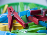 Plastic, colored clothespins are seen in a bucket on 17 September, 2017. (