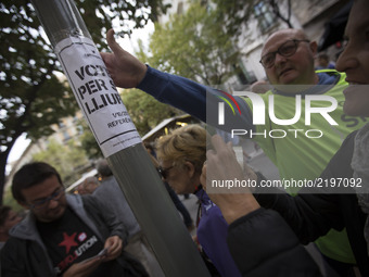 Members of the Catalan National Assembly, distribute information through the streets of Barcelona in full day, asking for the vote in the re...