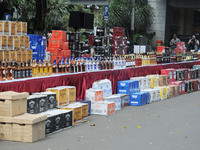  Indonesian police and customs officers examined the evidence of alcohol smuggling cases at regional police headquarters, Jakarta, Indonesia...