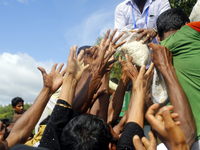 The photo taken on September 15 shows Rohingyas from Myanmar gathering around a truck delivering clothes in Ukhia, Cox’s Bazar. Around 370,0...