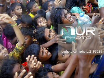 The photo taken on September 15 shows Rohingyas from Myanmar gathering around a truck delivering clothes in Ukhia, Cox’s Bazar. Around 370,0...