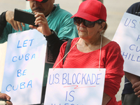 Canadians rally outside the American Consulate to demand an end to the American blockade against Cuba (the United States embargo against Cub...