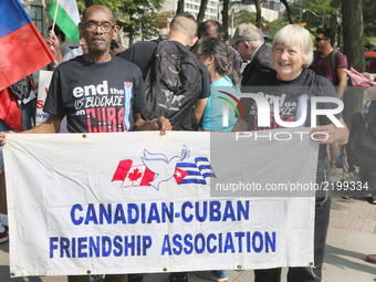 Canadians rally outside the American Consulate to demand an end to the American blockade against Cuba (the United States embargo against Cub...