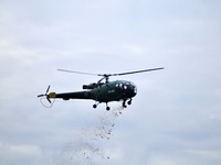 Nepalese Army Helicopter pass by throwing flowers during celebration of Constitution Day at Nepal Army Pavilion, Tundikhel, Kathmandu, Nepal...