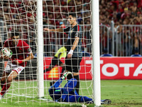 Moroccan professional footballer Walid Azaro of Al-Ahly scores a goal during the CAF Champions League quarterfinal first-leg football match...