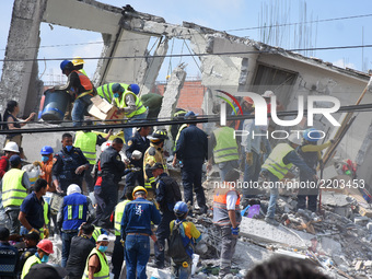 Rescuers are seen during the helping  people after 7.1 earthquake    ocurred in Mexico City on September 19, 2017. On September 19, 1985, an...