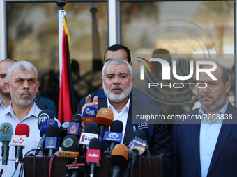 Hamas Chief Ismail Haniyeh speaks to the press upon his arrival on the Palestinian side of the Rafah border crossing, in the southern Gaza S...