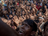 Rohingya refugees stretch their hand for relief supplies given by local people in Balikhali, Cox’s Bazar, Bangladesh. September 16, 2017. (