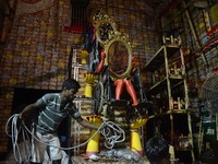 Indian workers busy in decorates the  puja pandal or temporary platform  ahead of Durga Puja festival in Kolkata, India on  Wednesday, 20th...