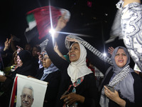 Palestinian supporters of Fateh movement and Palestinian president Mahmud Abbas (portrait) gather in Gaza City as Abbas addresses the 72nd U...