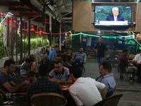Palestinians watch on a TV the Palestinian President Mahmoud Abbas during speaks the General Debate of the 72nd United Nations General Assem...