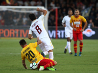  Ledian Memushaj (L) of Benevento competes for the ball in air with  Diego Perotti (R) of Roma during the Serie A match between Benevento Ca...