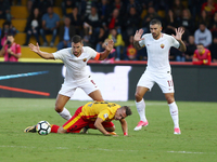 Gaetano Letizia (C) of Benevento competes for the ball in air with Strootman Kevin (L) of Roma during the Serie A match between Benevento Ca...