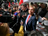 Jean Luc Melenchon (C), member of the national assembly addresses people at a rally in Paris, France on September 21, 2017 gathered to oppos...