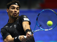 Fabio Fognini of Italy returns the ball to Mikhail Youzhny of Russia during the St. Petersburg Open ATP tennis tournament match in St. Peter...