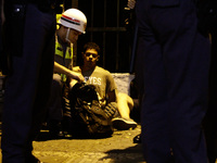 Police arrest a protester against the decision of a Brazilian judge who approved gay conversion therapy in Sao Paulo, Brazil on September 22...