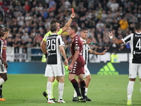 The referee expels Baselli of Torino during the Serie A football match between Juventus FC and Torino FC at Allianz Stadium on 23 September,...