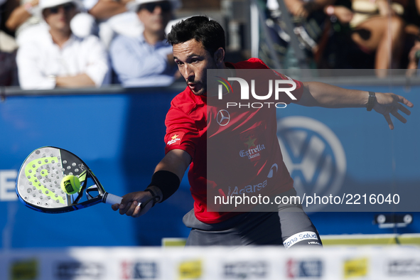 Carlos Gutierrez of Argentina hits a backhand playing with Francisco Navarro of Spain during the Portugal Masters Padel 2017 men's doubles f...