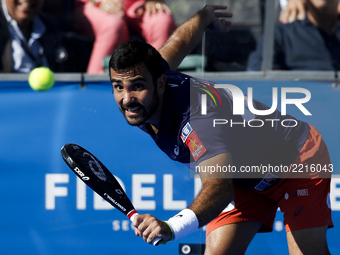 Pablo Lima of Brasil hits a backhand playing with Fernando Belasteguin of Argentina during the Portugal Masters Padel 2017 men's doubles fin...