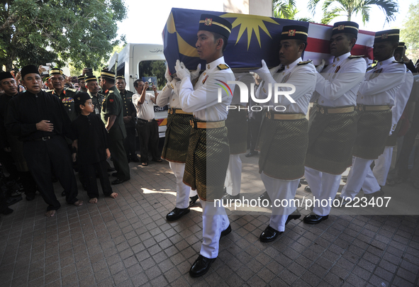 Malaysia Army personnel carry the coffin of in-flight supervisor Mohd Ghafar Abu Bakar, one of the victim of MH17 during a special prayer in...