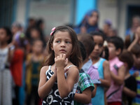 Homeless Palestinian children stand in a symbolic line organized by the United Nations Relief and Works Agency (UNRWA) during an action to b...