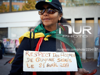 A woman wears a plaacrd asking for Macron to respect the French Guyana agreements. More than 15000 protesters took to the streets of Toulous...