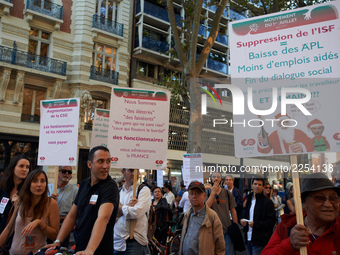 Placards against Macron's politics. More than 15000 protesters took to the streets of Toulouse against the new Macron's reforms on the Work...
