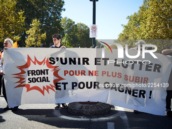 A banner reads 'Uniting and fighting for winning and no more suffer'. More than 15000 protesters took to the streets of Toulouse against the...