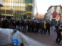 Youths confront riot police at the end of the demonstration. More than 15000 protesters took to the streets of Toulouse against the new Macr...