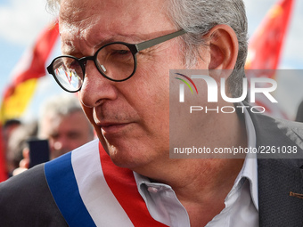 Secretary general of the French Communist Party, Pierre Laurent (C) takes part in a Metalworkers demonstration as they march with banners an...