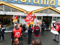 Members of unions gather in front of a French tools and supplies retailer Castorama store in Creteil, East of Paris, on December 1, 2017, to...