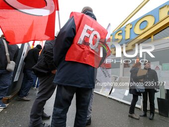 Members of unions gather in front of a French tools and supplies retailer Castorama store in Creteil, East of Paris, on December 1, 2017, to...
