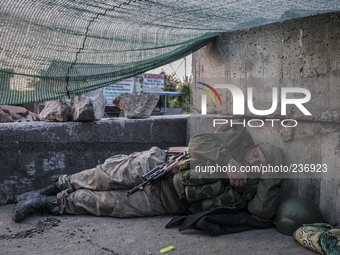 Pro-Russian militant sleeping after a night of intense fighting (Photo by Sandro Maddalena/NurPhoto)