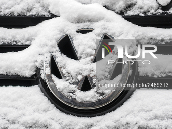 Snowflakes are seen on the badge of a Volkswagen car in Warsaw, Poland February 8, 2018. (