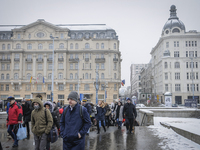 Commuters are seen exiting and underpass on Plac Defilad in central Warsaw on February 8, 2018. (