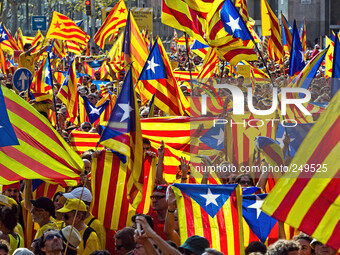 National Day of Catalonia, People wave flags during a demonstration calling for the independence of Catalonia in Barcelona, Spain,  Sept 11,...